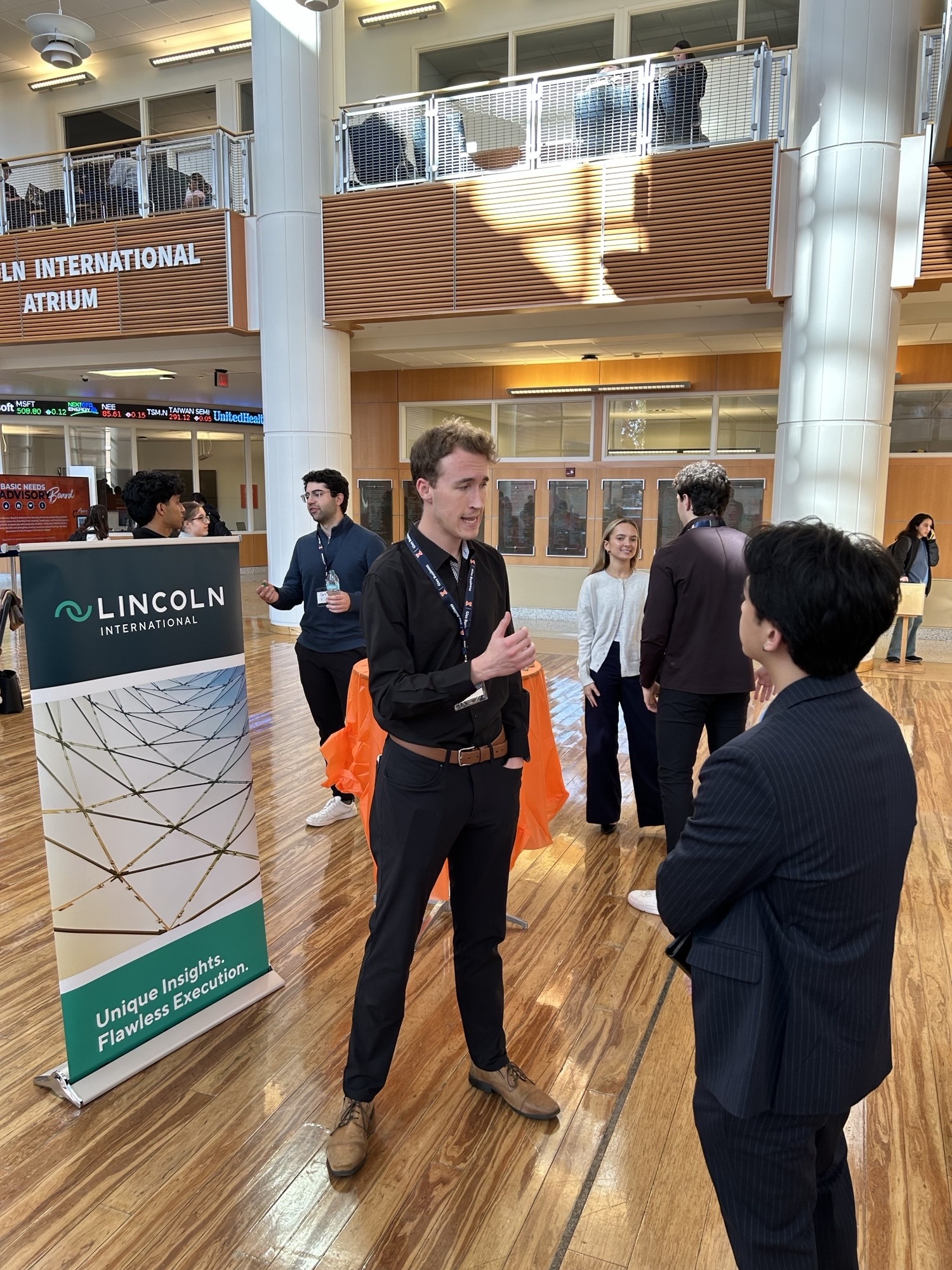 Lincoln International Business Rep talking with Studet