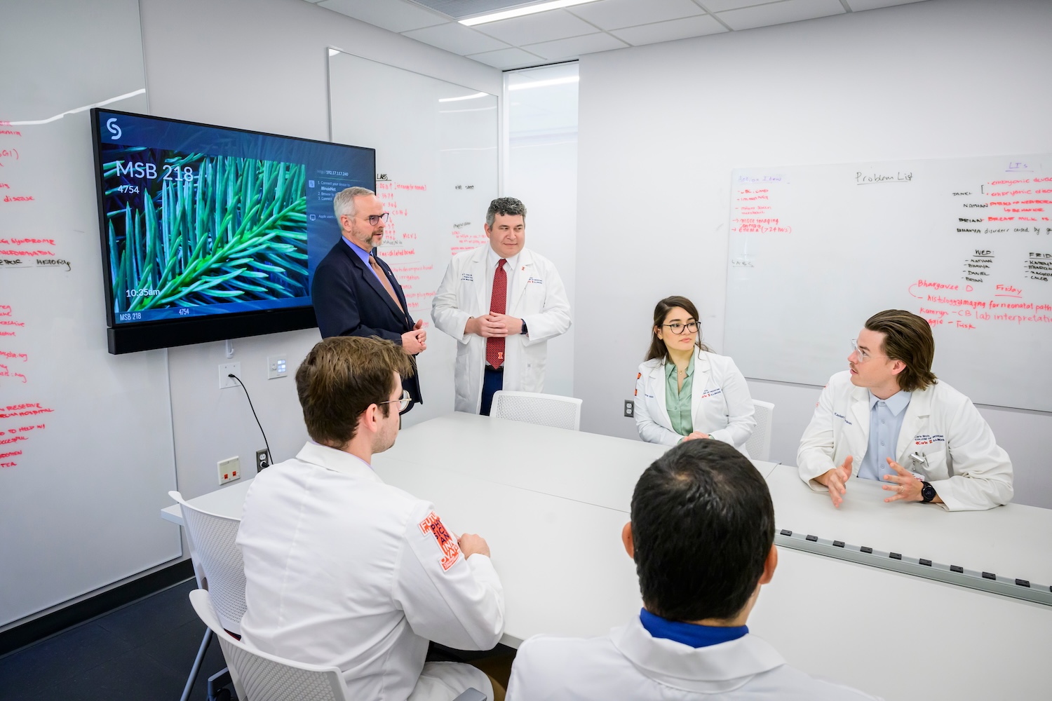 Students from Carle Med School with Professor in classroom