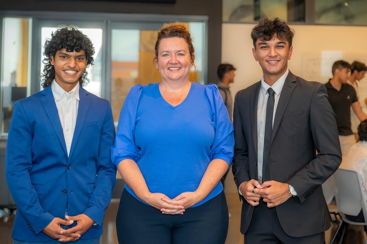 Disruption Lab students standing with teacher.