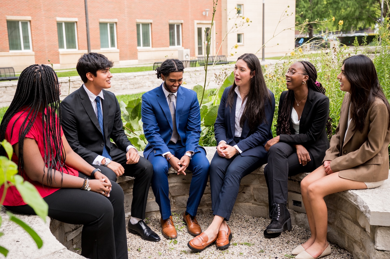 Students sitting in the BIF courtyard talking and laughing.