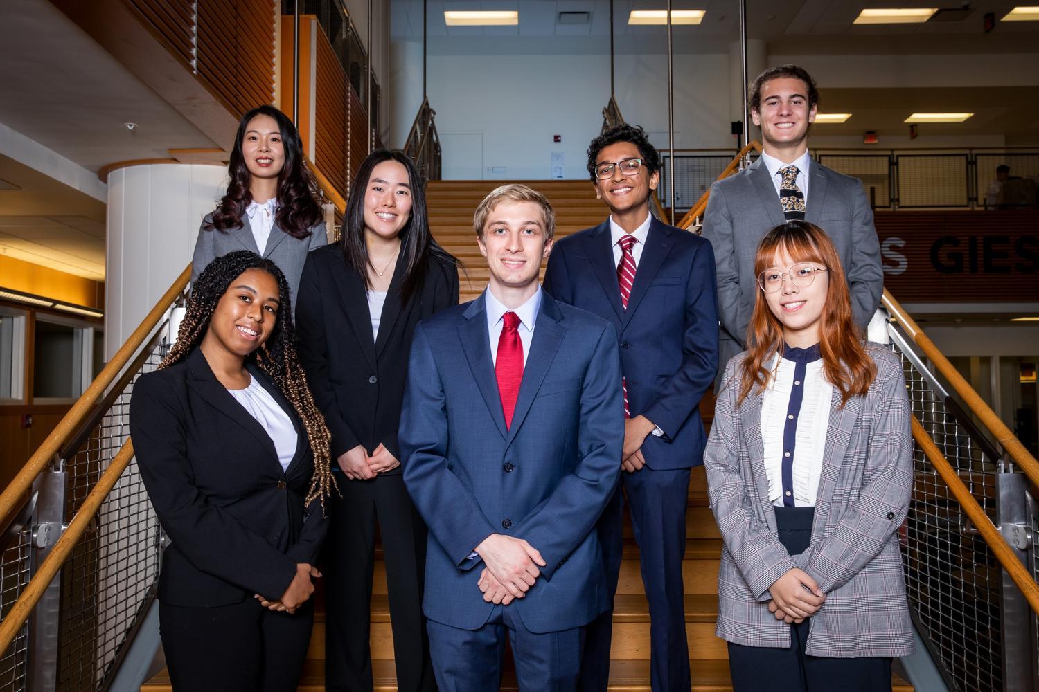 IBC Students standing in stairway looking toward camera