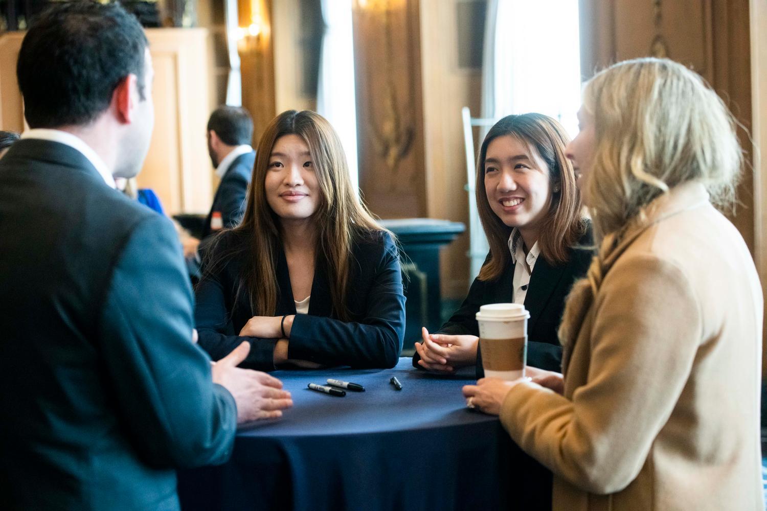 Two women networking at table