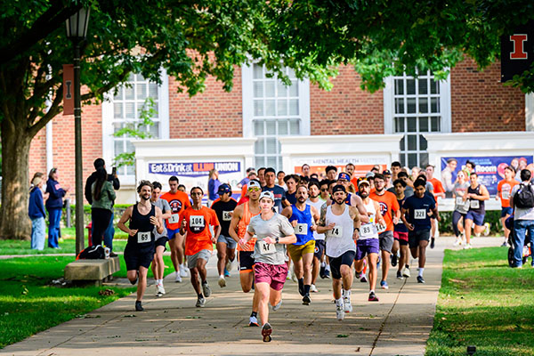 Students Running in a Race on Campus Students Running in a Race on Campus