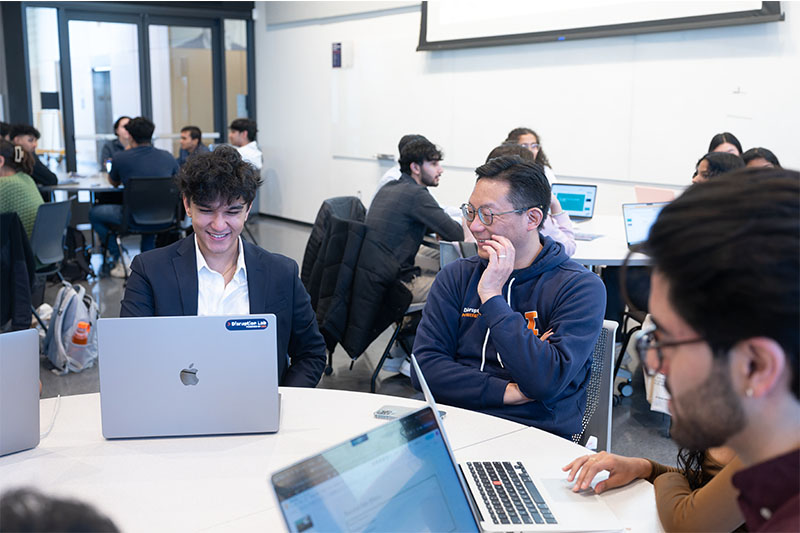 Professor and students collaborating
