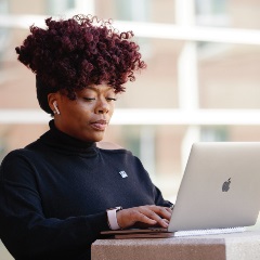 iMBA Student on Laptop